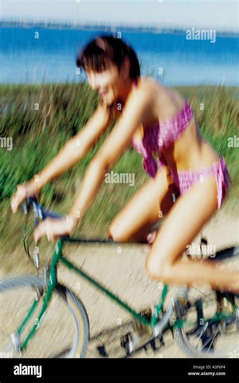 Girl Riding Bicycle In Bikini On Sunny Day Stock Photo Alamy
