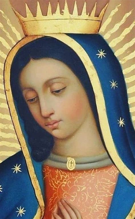 An Image Of The Virgin Mary In Blue And Gold