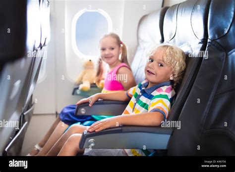 Child In Airplane Kids Sit In Air Plane Window Seat Flight