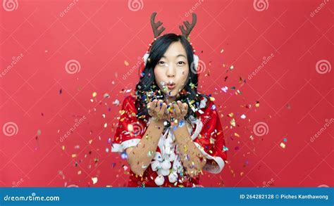 Happy Lovely Woman With Red Santy Costume Sending A Kiss To Camera On