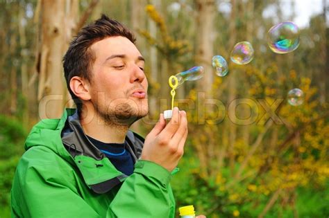 Man Blowing Bubbles Outdoor Stock Photo Colourbox