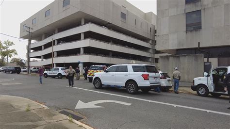 inmate attempts escape by jumping off third floor of parking garage in alexandria