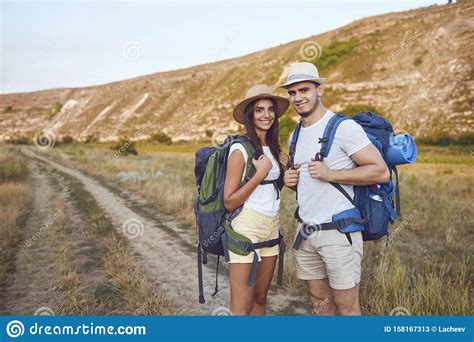 Couple Hikers With Backpack Walking On Hike In Nature Stock Image