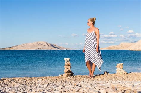 Happy Carefree Woman Enjoying Late Afternoon Walk On White Pabbled Beach On Pag Island Croatia