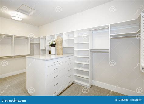 Huge Walk In Closet With Shelves Drawers And Clothes Rails Stock Image