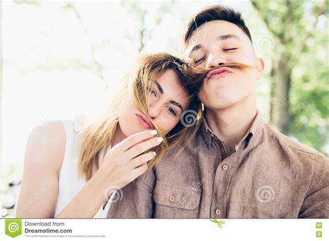 Guy Doing Mustache Of Girl S Hair Stock Image Image Of Outdoor