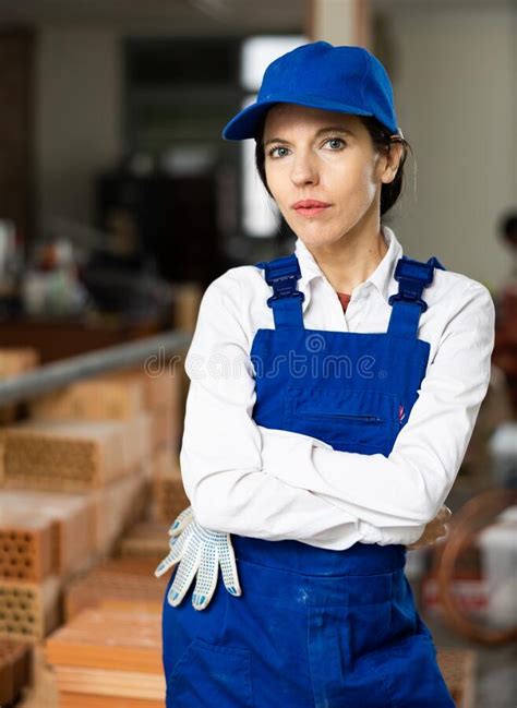 Confident Female Builder Posing At Construction Site Indoors Stock
