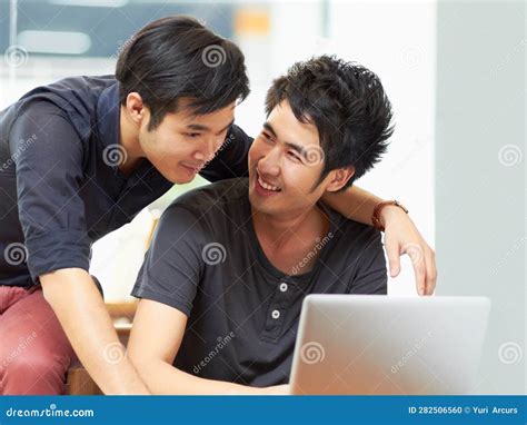 Teamwork Gay Couple Working With Laptop And At Their Home Together Happy Collaboration Or