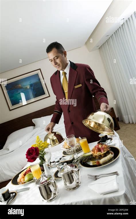 Waiter Serving Food Stock Photo Alamy