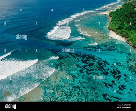 Balinese Coastline With Turquoise Ocean With Waves And Powerful Current