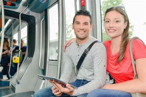 Couple On Public Transport Holding Tablet Stock Image Image Of