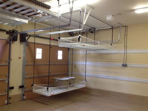 This system makes your storage so much more straightforward, taking all the clutter out of the way. a pulley system for storage in the garage...traditional ...