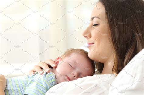 Happy Mother Sleeping With Her Baby Containing Sleeping Mother And