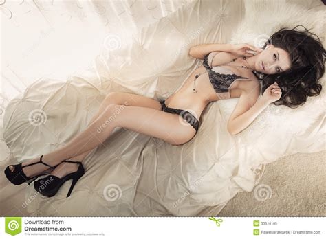 Attractive Brunette Lying On Bed Stock Image Image Of