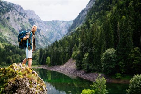 Traveler Man Relaxing With View Mountains And Lake Landscape Stock
