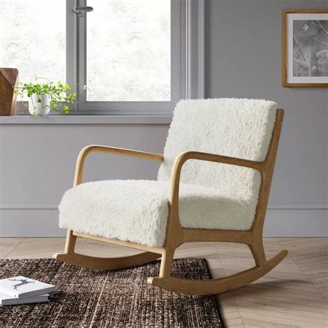 This is an ideal place to feed, belch and soothe your baby or even sleep. Esters Wood Arm Chair Sherpa White - Project 62™ in 2020 | Wood arm chair, Rocking chair nursery ...