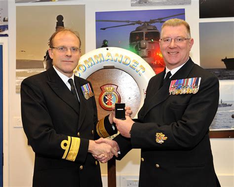 warrant officer receives long service medal royal navy