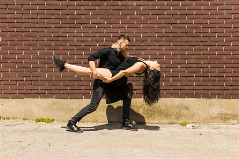 free photo sexy tango dancer dancing against wall