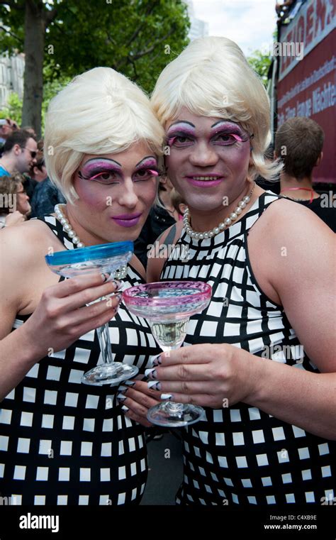 Two Men Dressed As Women Posing At The Christopher Street Day Parade In