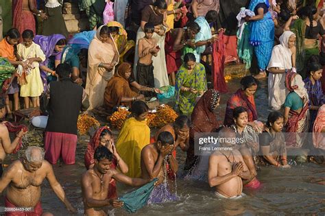 Hindu Pilgrims Bathing And Worshipping In Ganges River Elevated View