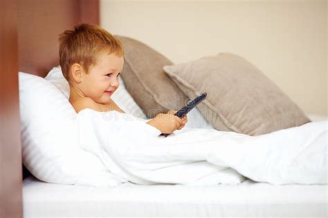 Kid Watching Tv Cartoons In Bed Stock Photo Image Of Morning Inside