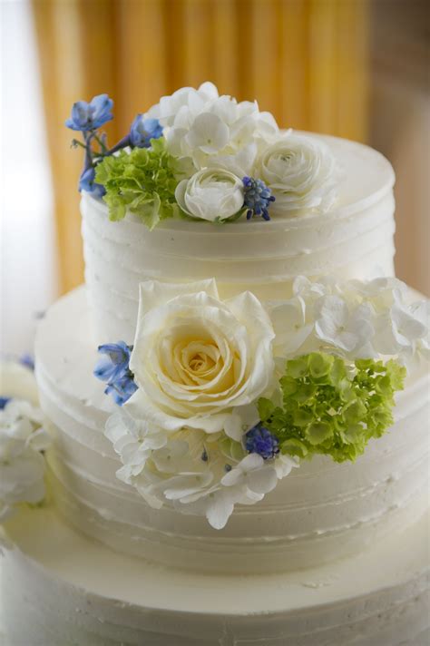 Three Tier Buttercream Wedding Cake With White Blue And