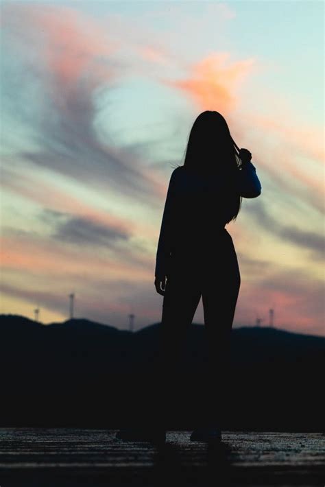 Silhouette Of Lonely Girl In The Field Posing At Sunset Lonely Girl Photography Lonely Girl