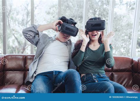 Young Couple Having Fun Exciting While Watching Video Via Virtual