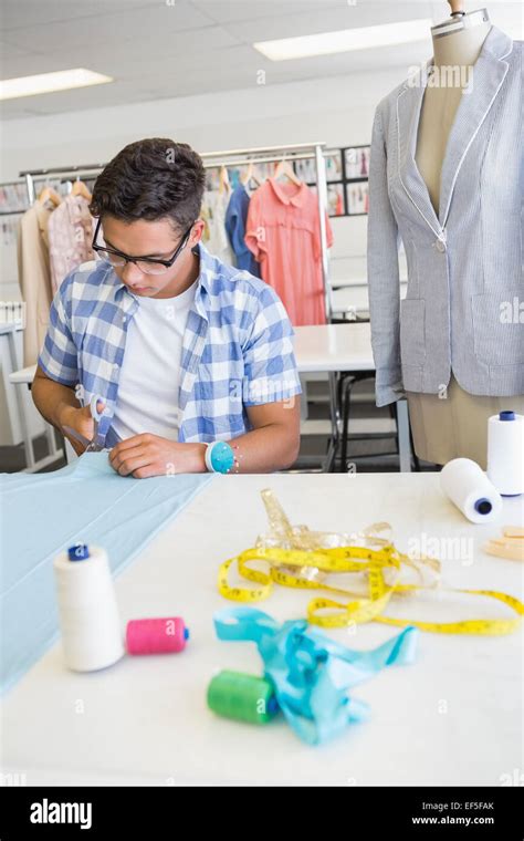 Fashion Student Cutting Fabric With Pair Of Scissors Stock Photo Alamy