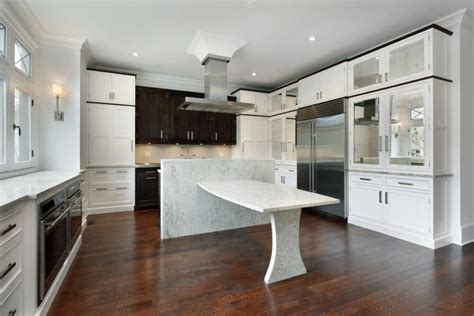 If you want more texture on the cabinets and in the floors without looking too busy, a great combination is stained knotty alder cabinet material paired with wood flooring that has a lot of color variation such as natural red or white oak or hickory. 34 Kitchens with Dark Wood Floors (Pictures)