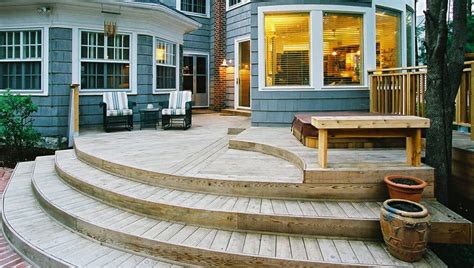 A simple wooden deck floats in a meadow. Choosing the Right Wood for Your Fence or Deck