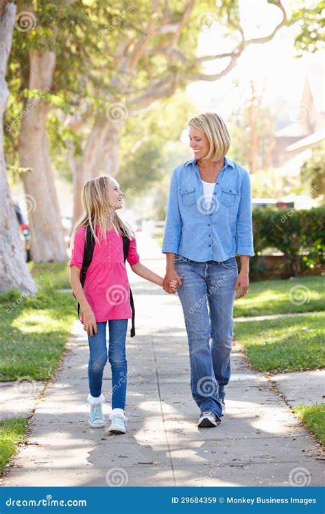 Mother And Daughter Walking To School On Suburban Street Stock Image Image Of Neighbourhood