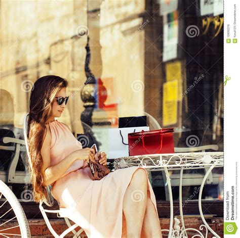 Young Pretty Brunette Woman After Shopping Sitting At Cafe Outside On
