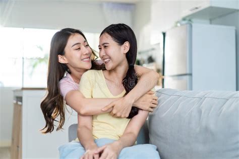 Asian Beautiful Lesbian Women Couple Hugging Girlfriend In Living Room Attractive Two Female