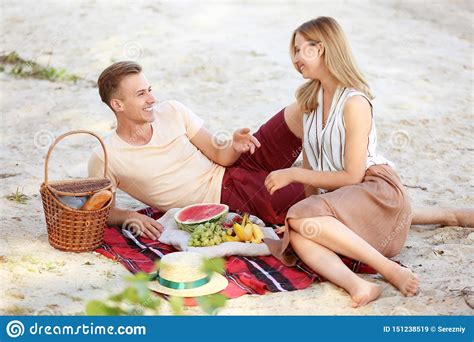 Cute Young Couple Having Picnic On Romantic Date Outdoors Stock Image