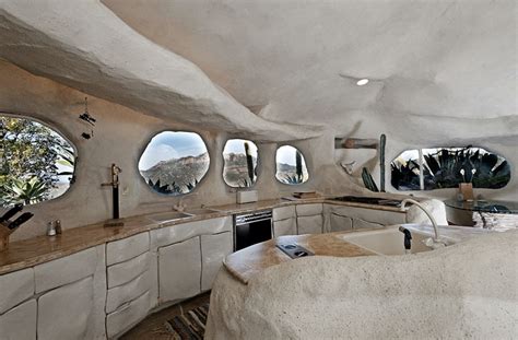 Flintstone Style House Cave Rock Kitchen Round Windows Interior