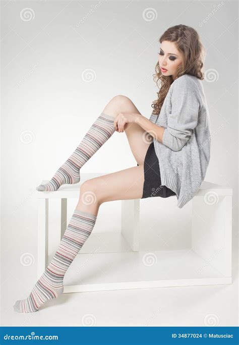 Beautiful Woman With Long Sexy Legs In Winter Socks Posing In The Studio Stock Images Image