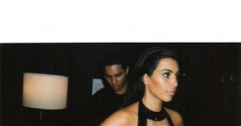 Kim Kardashian Flashes Side Boob While Squeezing Her Curves Into