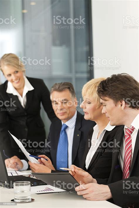 Business Team Meeting In An Office Setting Stock Photo Download Image