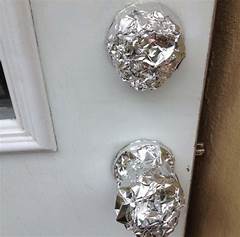 Wrapping Tin Foil Around Door Knobs
