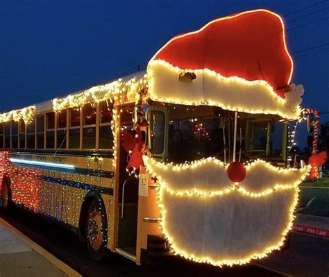 A Babe Bus Decorated With Christmas Lights And A Santa Hat