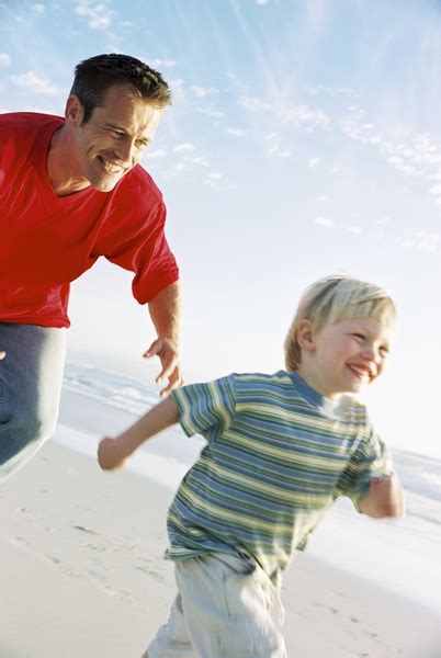 Father Chasing His Son On The Beach Free Photo Download Freeimages