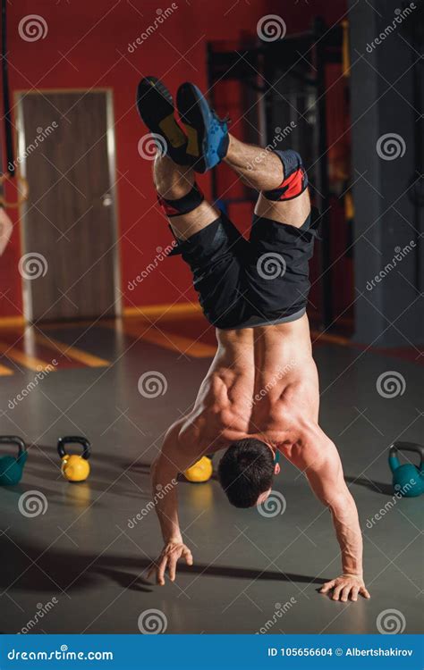 Young Male Athlete Doing Handstand Indoors Stock Photo Image Of