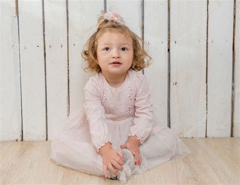 Funny Stylish Little Girl Sitting On The Floor — Stock Photo © Tan4ikk