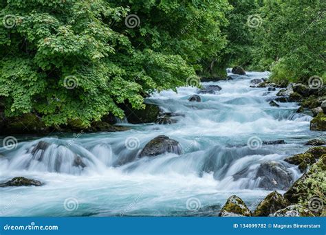 Turquoise Flowing Water In A River In Norway Stock Photo Image Of