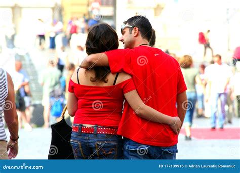 Young Italian Couple Walking On The Streets Of Rome On A Beautiful