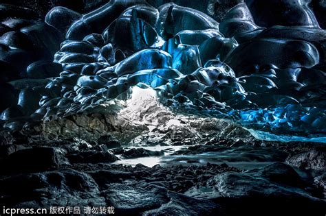 Amazing Waterfall Falls Through Ice Caves 4 Cn