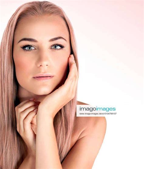 Closeup Face Portrait Of A Beautiful Woman Isolated On Pink White