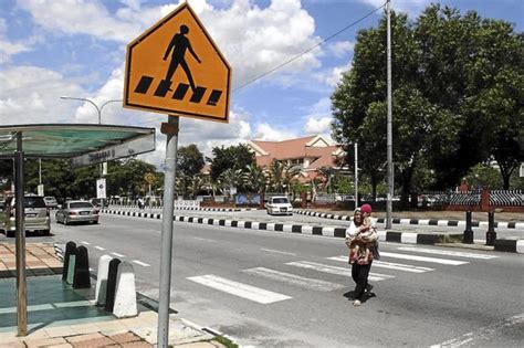 On some pelicans, the green man. Letter: Jalan Raja Musa Aziz's zebra crossing looses its ...