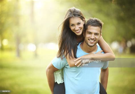 Happy Couple In Park High Res Stock Photo Getty Images